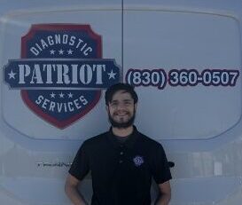 Patriot Diagnostic Services technician standing in front of branded mobile service van